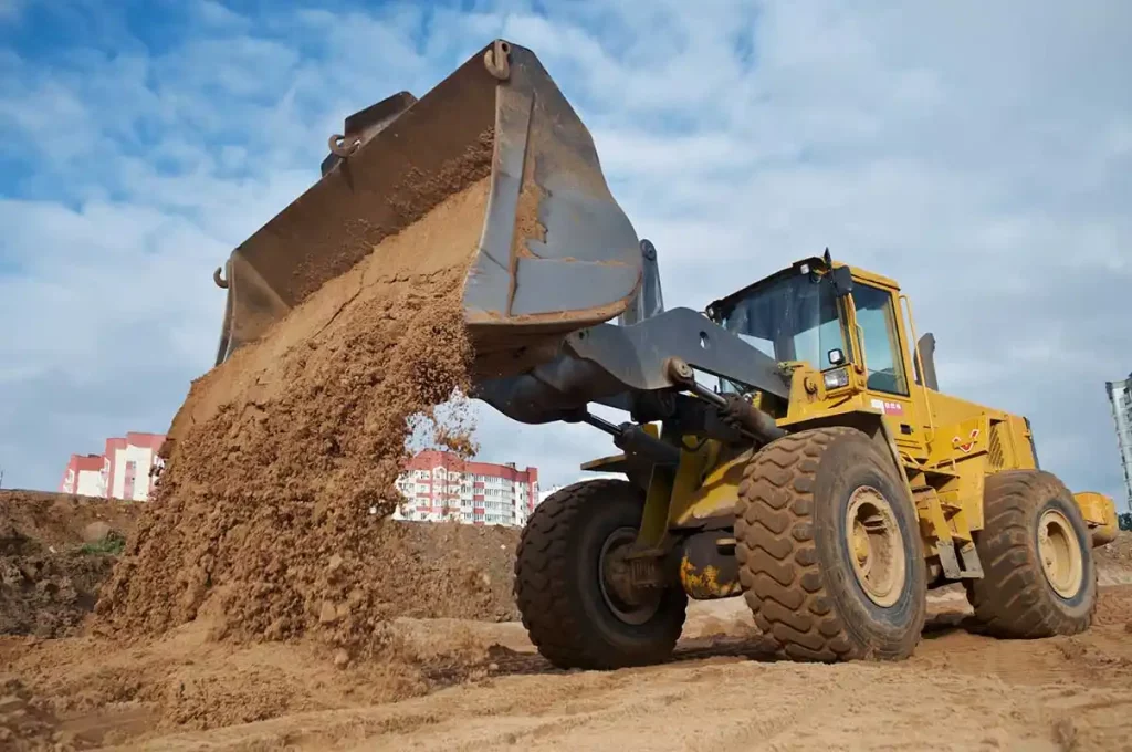 front end loader moving sand